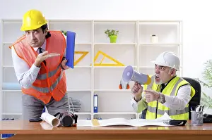 One Person Laboring Prints: Two engineers colleagues working under project