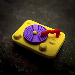 Textured Background Image Prints: Eraser representing a record player on a textured background