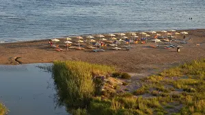 Evening Beach Scene Prints: Evening light, beach, umbrellas