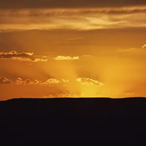 Text Free Space For Copying Prints: Evening sky with sun rays over Table Mountain