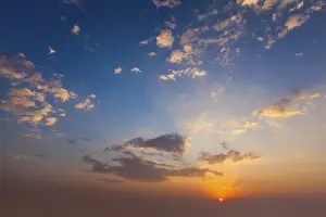 Atmospheric Evening Mood Prints: Evening sunset sky with sun and dramatic clouds