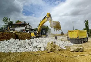 Excavator Construction Site Prints: Excavator work at a construction site