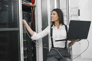 Digital Data Protection Prints: IT expert checking supercomputer server