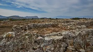 Southeastern Europe Heritage Prints: Extensive ruins with stone structures under a cloudy sky