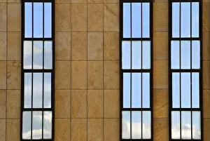 Office Building Facade Prints: Facade divided into three with reflection in the windows