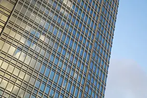 Blue Sky Architecture Prints: Facade of the skyscraper with windows over blue sky