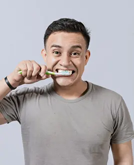 Dental Care Prints: Face of handsome man brushing his teeth