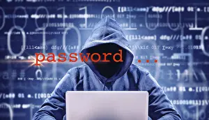 Data Transmission Security Prints: faceless hacker on a laptop