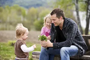 Happy Family Outdoors Prints: Father and kids in springtime