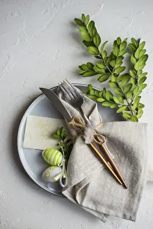 Plain White Background Photo Prints: Festive table setting for Easter dinner on white background with copy space