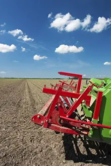 Farmland Cultivation Prints: Fields with young vegetable fields and detail of planting machine