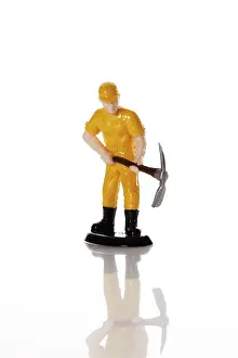 Symbolic Construction Image Prints: Figure of a construction worker with hard hat and pickaxe