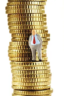 Euro Coin Stack Prints: Figurine of a heavy manager on a stack of coins