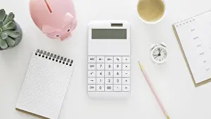 Deserted Office Space Prints: Finance elements arrangement with empty notepad calculator