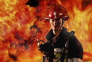 Protective Clothing For Firefighters Prints: Firefighter in front of a wall of fire