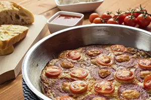 Homemade Meal Ideas Prints: Fittata in a pan on brown breakfast table