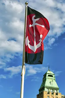 Swedish Harbour Prints: Flag with anchor against a slightly cloudy sky