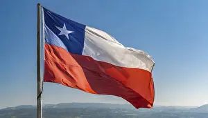 Blue Sky National Emblem Prints: The flag of Chile flutters in the wind