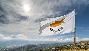 Blue Sky With Flag Prints: The flag of Cyprus flutters in the wind