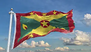 Prints of The flag of Grenada, Caribbean, flutters in the wind, isolated, against the blue sky Related Prints: Grenada Flag Print, Caribbean Sky