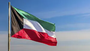 Kuwait Flag Prints: The flag of Kuwait flutters in the wind