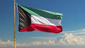 Arabian Peninsula Flags Prints: The flag of Kuwait flutters in the wind
