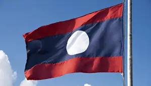 Asian National Emblem Prints: The flag of Laos flutters in the wind