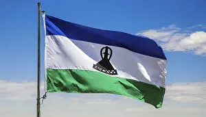 Digital Composing Of Flags Prints: The flag of Lesotho, fluttering in the wind