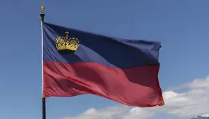 Prints of The flag of Liechtenstein flutters in the wind Liechtenstein Prints: The Flag of Liechtenstein Print