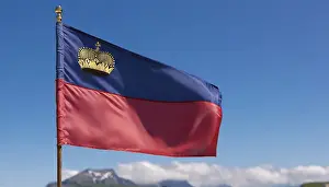 Prints of The flag of Liechtenstein flutters in the wind Liechtenstein Prints: The Flag of Liechtenstein Print