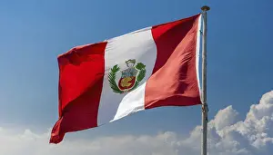 Blue Sky National Emblem Prints: The flag of Peru flutters in the wind