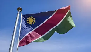 Blue Sky Flags Prints: Flags, the national flag of Namibia flutters in the wind