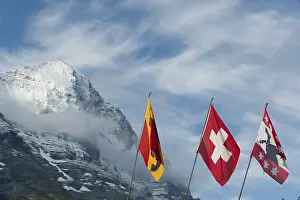 Swiss Alps Landscape Photo Prints: Flags in front of the snow-covered Eiger Mountain