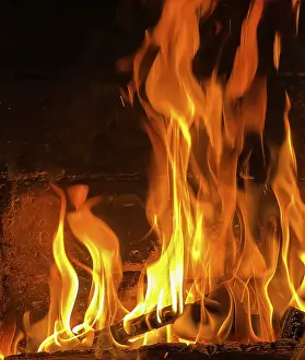 Flames of Fire Print - Burning Wood in a Dark Fireplace