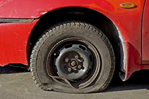 Close Up Car Part Prints: Flat tire