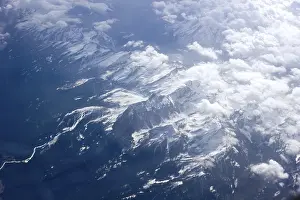Cloudy Mountain Landscapes Prints: Flight over the Alps