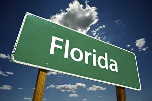 Symbolic Road Picture Prints: Florida road sign with dramatic clouds and sky