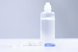 White Table Setup Prints: Fluid and lens boxes are on a white table