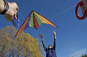 Teamwork And Friendship Prints: Flying a kite