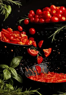 Dark Colored Background Prints: Flying tomatoes, whole and sliced