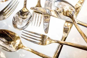 Empty Table Setting Photos Prints: Fork, spoon and knife with reflections and light effects