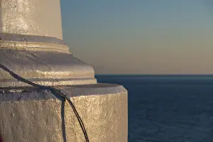 Uninhabited Lighthouse Structure Prints: Foundation of a lighthouse at sunset