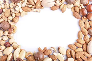Healthy Eating Picture Prints: Frame made from different kinds of nuts on white background