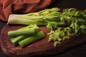 Dark Background Celery Prints: Fresh bunch of celery, top view