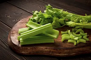 Dark Background Vegetables Prints: Fresh bunch of celery, top view