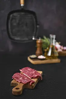 Raw Lamb Prints: Fresh lamb steak on kitchen table