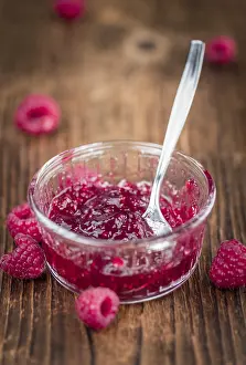 Shallow Depth Of Field Images Prints: Fresh made Raspberry Jam on an old and rustic wooden table