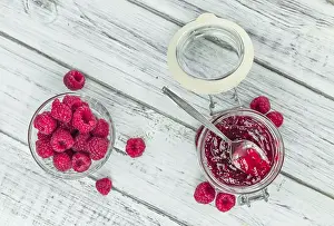 Selective Focus Photography Prints: Fresh made Raspberry Jam on an old and rustic wooden table