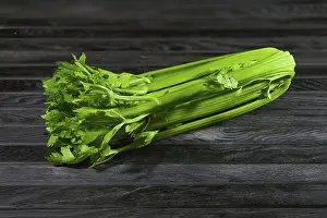 Kitchen Table Still Life Prints: Fresh wet celery on an old kitchen table