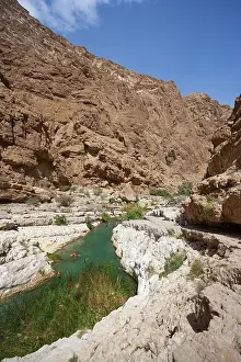 Blue Sky Water Scene Prints: Freshwater pool between rugged cliffs